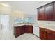 The kitchen features dark wood cabinetry and a breakfast bar for casual dining at 36730 Oconee Ave, Eustis, FL 32736