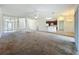 Spacious living area with tile and carpet flooring, connecting multiple rooms at 36730 Oconee Ave, Eustis, FL 32736