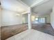 Spacious living room featuring neutral carpet, columns, and ample natural light at 36730 Oconee Ave, Eustis, FL 32736
