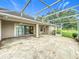 Large screened patio overlooking the golf course, perfect for outdoor living and entertaining at 36730 Oconee Ave, Eustis, FL 32736