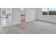 Bright bedroom featuring carpet floors, an open entryway, and a large window with a view at 3756 Watercliff Cir, Grand Island, FL 32735