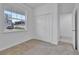 Bedroom featuring carpet, a window with a neighborhood view, and a closet at 3756 Watercliff Cir, Grand Island, FL 32735