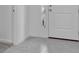 Inviting entryway featuring neutral tile flooring leading to other rooms of the house at 3756 Watercliff Cir, Grand Island, FL 32735
