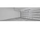 A clean, empty garage with a white door at 3756 Watercliff Cir, Grand Island, FL 32735