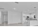 Bright kitchen features white cabinets, stainless appliances, and granite countertops at 3756 Watercliff Cir, Grand Island, FL 32735