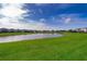 Large backyard overlooking serene lake, providing a peaceful and picturesque setting for outdoor activities at 3943 Crawley Down Loop, Sanford, FL 32773