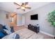 Upstairs bonus room with comfortable seating, a ceiling fan, and TV at 3943 Crawley Down Loop, Sanford, FL 32773