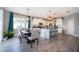 Modern kitchen with stainless steel appliances, granite countertops, and open to the dining and living areas at 3943 Crawley Down Loop, Sanford, FL 32773