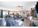 Open concept living space, seamlessly connecting the living room, dining area, and kitchen for modern living at 3943 Crawley Down Loop, Sanford, FL 32773