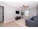 Cozy living room with comfortable seating, a ceiling fan, and a large window at 3943 Crawley Down Loop, Sanford, FL 32773