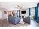 Bright living room with a modern fireplace, neutral tones, and ample seating at 3943 Crawley Down Loop, Sanford, FL 32773