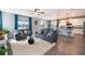 Open living space with modern furnishings, lake view, and adjacent dining area and kitchen for seamless entertaining at 3943 Crawley Down Loop, Sanford, FL 32773