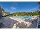 Community pool with brick paved patio, lounge chairs and greenery providing relaxation and recreation at 3943 Crawley Down Loop, Sanford, FL 32773