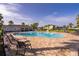 Beautiful community pool with a paved patio and lounge chairs for relaxing and enjoying the sunshine at 3943 Crawley Down Loop, Sanford, FL 32773