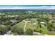 Great aerial view of a property with a well-maintained lawn, buildings and mature trees at 4160 Packard Avenue, St Cloud, FL 34772