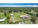 Expansive aerial view of the property showcases a pool, barn, main house and guest house at 4160 Packard Avenue, St Cloud, FL 34772