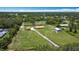 Gorgeous aerial view of large lot with home, storage building and mature trees at 4160 Packard Avenue, St Cloud, FL 34772
