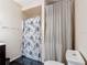 Bathroom with shower and patterned shower curtain at 4160 Packard Avenue, St Cloud, FL 34772