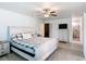 Bright bedroom featuring tile flooring and a private bathroom at 4160 Packard Avenue, St Cloud, FL 34772