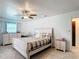 Well-lit bedroom featuring an accent rug, a ceiling fan, and neutral-toned decor at 4160 Packard Avenue, St Cloud, FL 34772