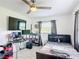 Comfortable bedroom decorated with dark curtains, filled with electronic devices and a single bed at 4160 Packard Avenue, St Cloud, FL 34772