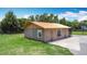 Quaint exterior showcasing a basketball hoop, and simple landscaping, providing an ample outdoor space at 4160 Packard Avenue, St Cloud, FL 34772