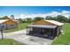 Lovely exterior showcasing a screened porch, patio, and basketball hoop, creating an inviting outdoor space at 4160 Packard Avenue, St Cloud, FL 34772
