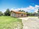 Lovely exterior showcasing landscaping, a basketball hoop, and outdoor space, providing an inviting curb appeal at 4160 Packard Avenue, St Cloud, FL 34772