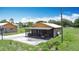 Inviting exterior featuring a screened porch, patio, and a well-maintained lawn, great for entertaining at 4160 Packard Avenue, St Cloud, FL 34772