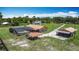Birds eye view of home, with a long driveway leading to a detached guest house and pool at 4160 Packard Avenue, St Cloud, FL 34772
