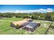 Aerial view of a single-story home featuring a screened-in pool and spacious backyard at 4160 Packard Avenue, St Cloud, FL 34772