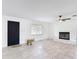 Bright living room featuring a fireplace, tile flooring, and a large window at 4160 Packard Avenue, St Cloud, FL 34772