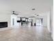 Open floorplan with tile flooring connects living room to the modern kitchen at 4160 Packard Avenue, St Cloud, FL 34772