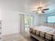 Bright main bedroom featuring sliding glass doors and tile flooring at 4160 Packard Avenue, St Cloud, FL 34772