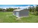 Metal outbuilding or garage for storage or workshop with roll up door at 4160 Packard Avenue, St Cloud, FL 34772
