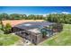 Elevated view of in-ground pool with screened enclosure and outdoor patio at 4160 Packard Avenue, St Cloud, FL 34772