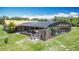 The in-ground pool, enclosed by a screen, offers a peaceful retreat with lush landscaping at 4160 Packard Avenue, St Cloud, FL 34772