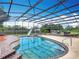 Beautiful screened pool with tropical landscaping and easy access from the patio at 4160 Packard Avenue, St Cloud, FL 34772