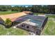 Screened-in pool area includes water feature, lounge chairs and lush landscape at 4160 Packard Avenue, St Cloud, FL 34772
