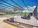 Beautiful screened pool with tropical landscaping and lounge area at 4160 Packard Avenue, St Cloud, FL 34772