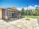 Inviting screen porch with comfortable seating, ideal for relaxation and enjoying the surrounding landscape at 4160 Packard Avenue, St Cloud, FL 34772