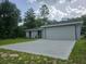 A view of the driveway leading to the two car garage in this well maintained single-story home at 4325 Sw 157Th Ter, Ocala, FL 34481