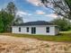This house features a sleek, modern exterior with a minimalist design and a well-manicured lawn at 4325 Sw 157Th Ter, Ocala, FL 34481