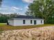 This house features a sleek, modern exterior with a minimalist design and a well-manicured lawn at 4325 Sw 157Th Ter, Ocala, FL 34481