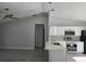 Bright and open concept kitchen with modern fixtures, stainless appliances, and an adjacent living area at 4325 Sw 157Th Ter, Ocala, FL 34481
