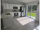This open kitchen features modern appliances, plenty of natural light, and a stylish backsplash at 4325 Sw 157Th Ter, Ocala, FL 34481