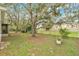 Expansive backyard with mature trees draped in Spanish moss creating a serene setting at 4865 Gorham Ave, Orlando, FL 32817