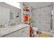 Bathroom features a single vanity with countertop, decorative shower curtain, and toilet at 4865 Gorham Ave, Orlando, FL 32817
