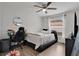 Relaxing bedroom features a ceiling fan, desk, and window at 4865 Gorham Ave, Orlando, FL 32817