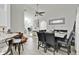 Inviting living space seamlessly connects to kitchen, featuring a modern ceiling fan and a versatile layout for easy entertaining at 4865 Gorham Ave, Orlando, FL 32817